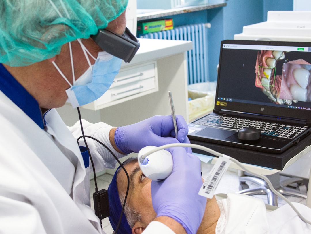 a-person-in-a-mask-and-gloves-using-a-laptop-ifhuhrodkcq